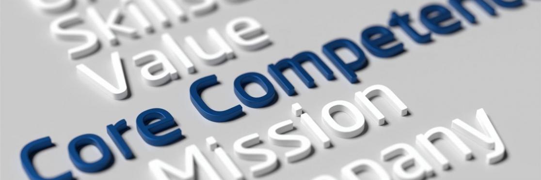 Hervorgehobene Begriffe wie Core Competence, Mission, Value und Skillset auf grauem Hintergrund – symbolisiert strategische Kompetenzmodelle und unternehmerische Kernfähigkeiten